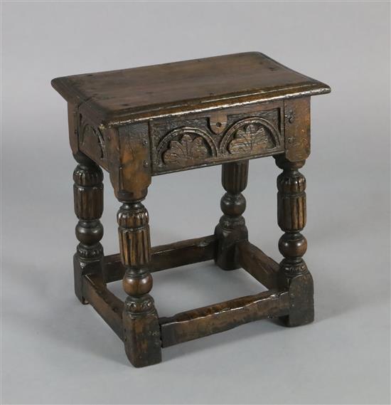 An oak joined stool, W.1ft 8in. D.1ft H.1ft 10in.